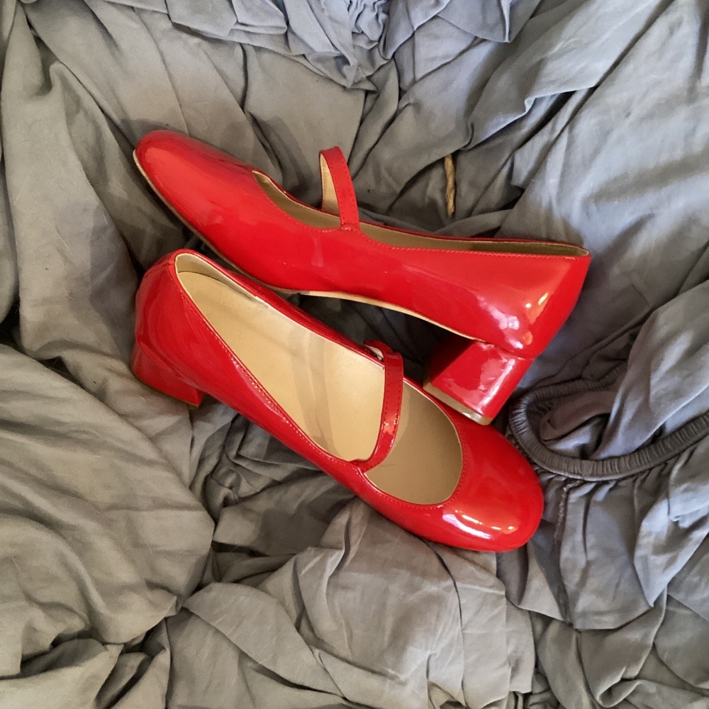 Red patent leather Mary Jane style shoes